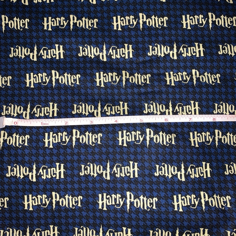 Camelot Harry Potter 100% cotton fabric Houndstooth background 44"W 36” L